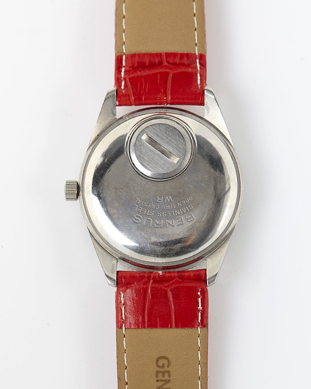 Backside of a Benrus Sport Citation vintage wristwatch on red alligator strap